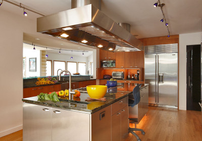 contemporary kitchen mixes wood, glass, stone and steel