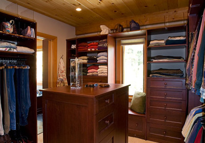 master walk in closet with gorgeous cabinety and natural light