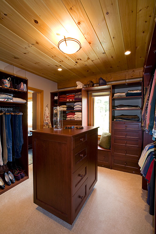 master walk in closet with gorgeous cabinety and natural light