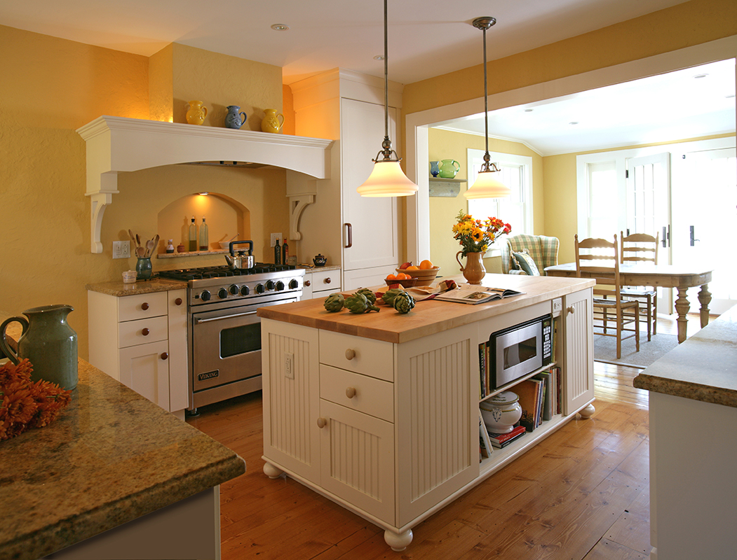 soft yellow stucco walls and granite countertops create a warm, inviting kitchen space