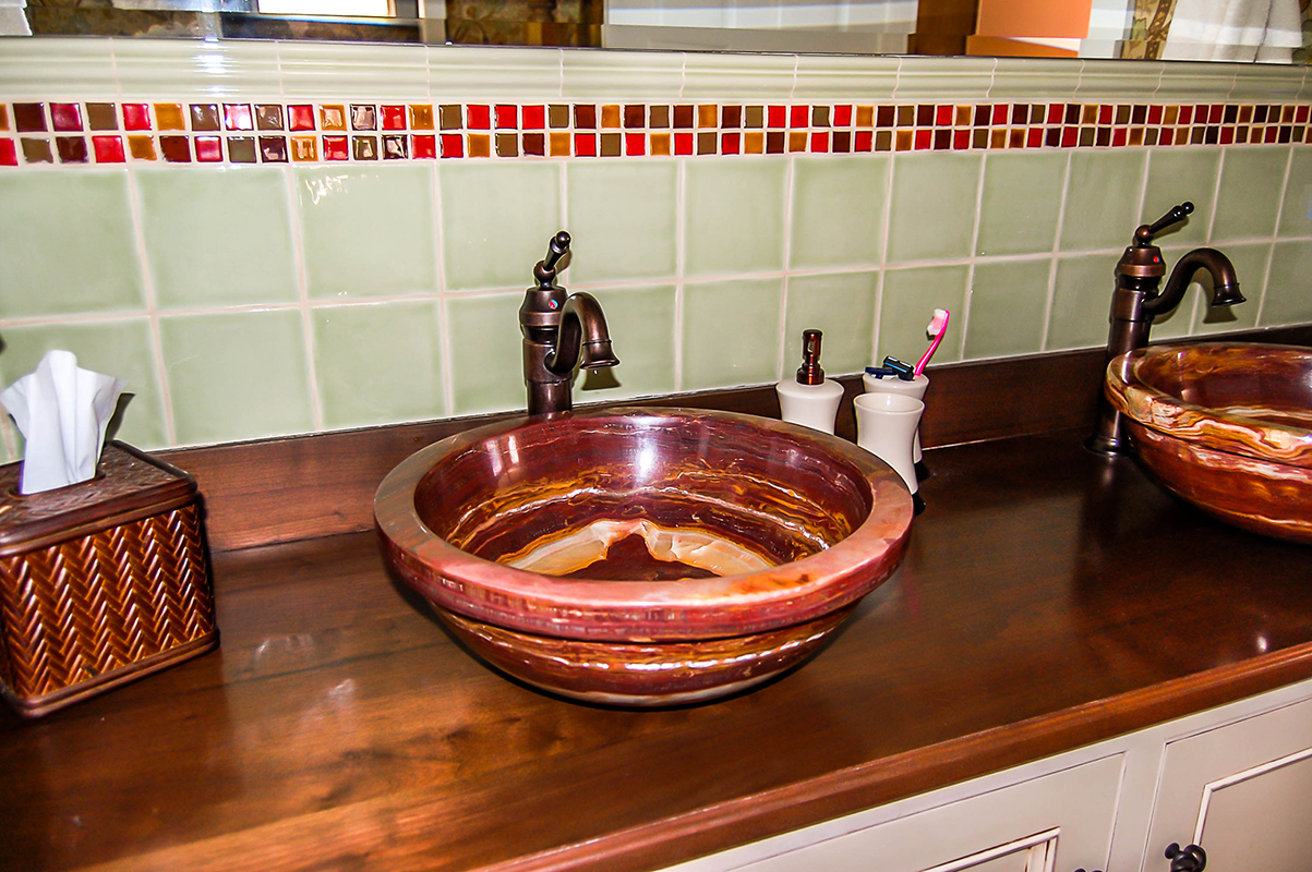 custom vessel sinks add personality to a master bath